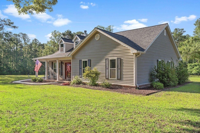1094 Paul Thompson Rd, Monticello, FL 32344 - cape cod-style house with a front yard, a porch, and roof with shingles