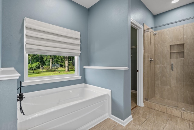 1094 Paul Thompson Rd, Monticello, FL 32344 - bathroom with a bath, a shower stall, and baseboards