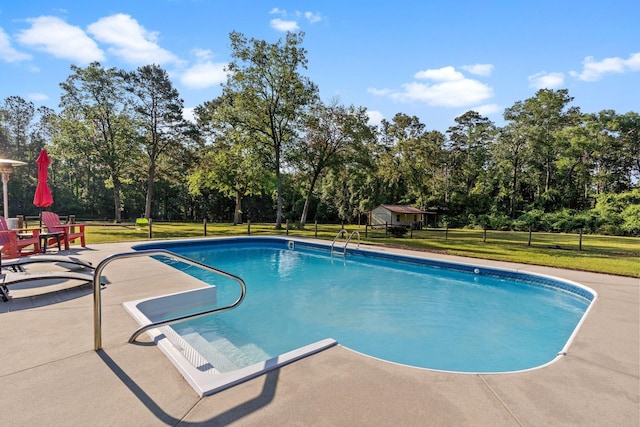 1094 Paul Thompson Rd, Monticello, FL 32344 - outdoor pool with a patio, a yard, and view of scattered trees