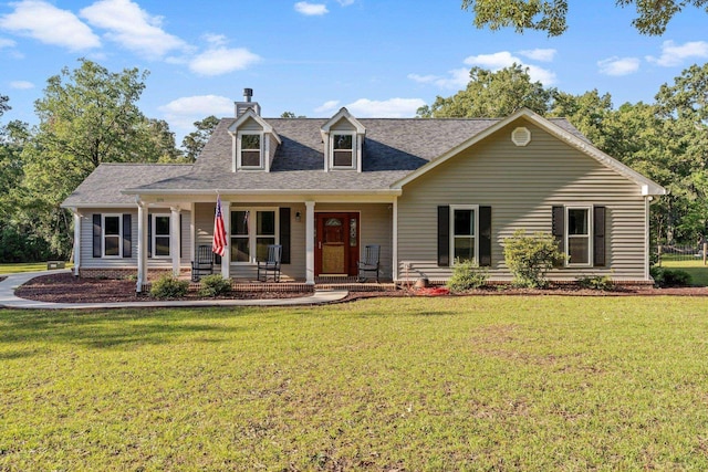 1094 Paul Thompson Rd, Monticello, FL 32344 - new england style home with a chimney, a front lawn, and covered porch