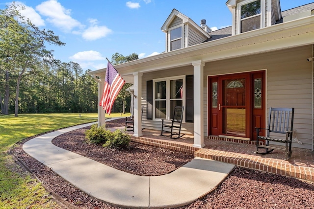 1094 Paul Thompson Rd, Monticello, FL 32344 - doorway to property featuring a porch and a yard