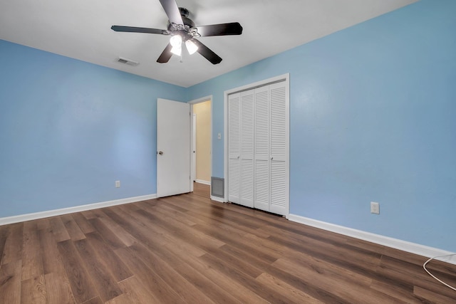 4054 Mcleod Dr, Tallahassee, FL 32303 - unfurnished bedroom with wood finished floors, a closet, and ceiling fan