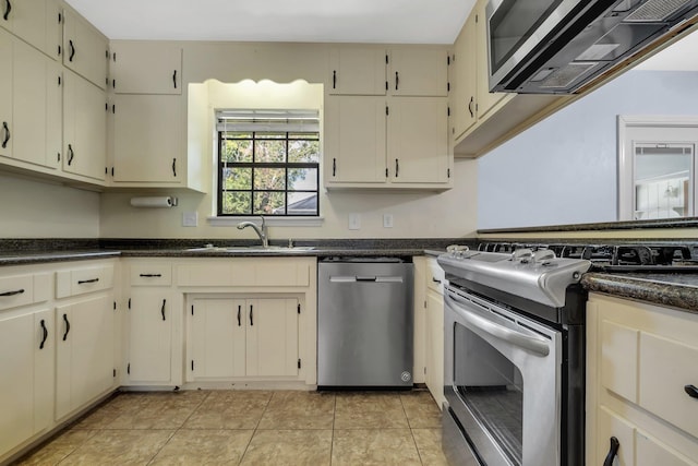 4054 Mcleod Dr, Tallahassee, FL 32303 - kitchen with appliances with stainless steel finishes and cream cabinets