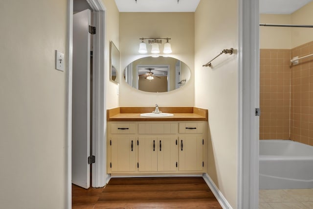 4054 Mcleod Dr, Tallahassee, FL 32303 - full bathroom featuring vanity, a ceiling fan, tub / shower combination, and wood finished floors
