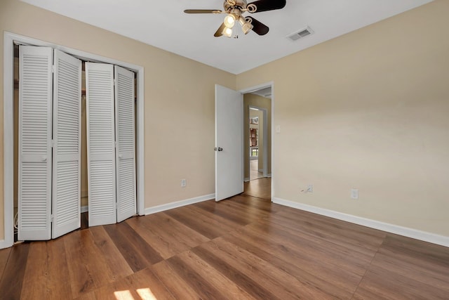4054 Mcleod Dr, Tallahassee, FL 32303 - unfurnished bedroom with a closet, wood finished floors, and ceiling fan