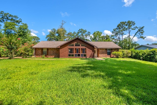 4054 Mcleod Dr, Tallahassee, FL 32303 - view of front of house with a front yard and brick siding
