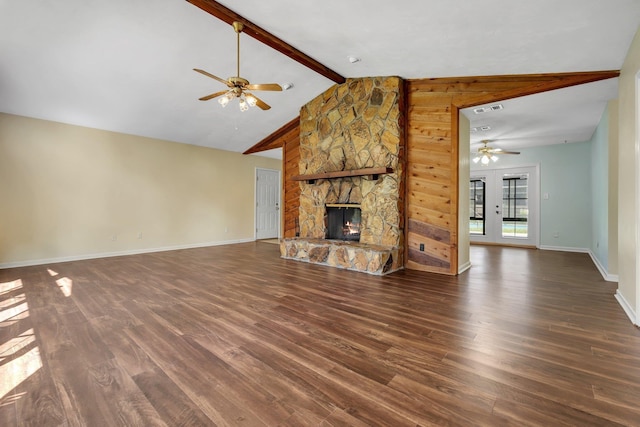 4054 Mcleod Dr, Tallahassee, FL 32303 - unfurnished living room with a ceiling fan, dark wood-type flooring, and a stone fireplace