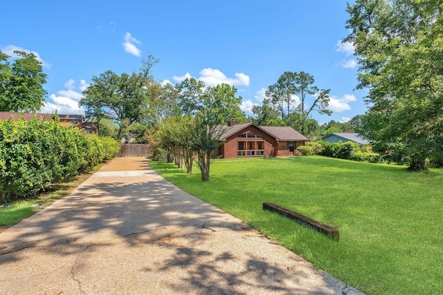 4054 Mcleod Dr, Tallahassee, FL 32303 - view of front of house with a front lawn and a chimney