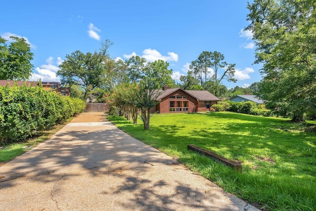 4054 Mcleod Dr, Tallahassee, FL 32303 - view of front of property with a front yard and a chimney