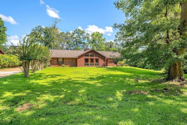 4054 Mcleod Dr, Tallahassee, FL 32303 - view of front of home featuring a front lawn and brick siding