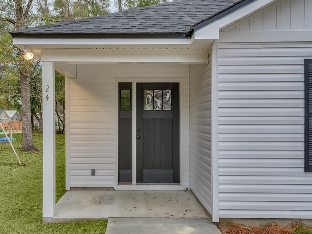 property entrance with a yard