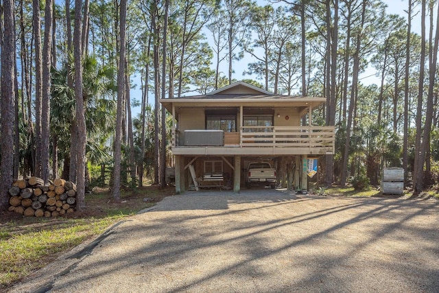 view of front of property with a carport and driveway