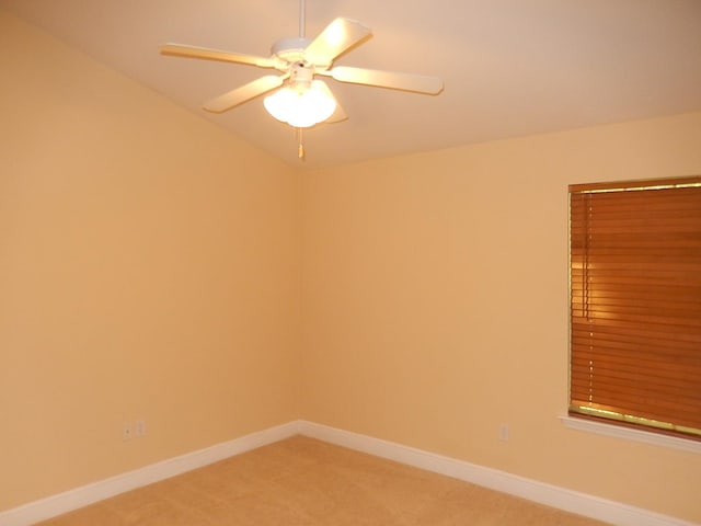 spare room with carpet flooring and ceiling fan