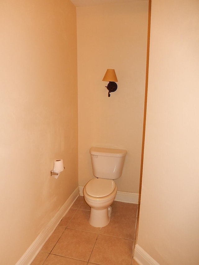 bathroom with tile patterned flooring and toilet