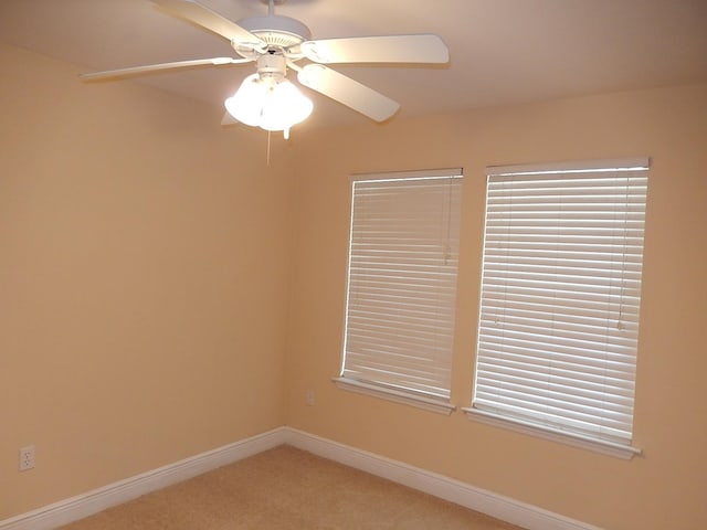 empty room featuring carpet and ceiling fan