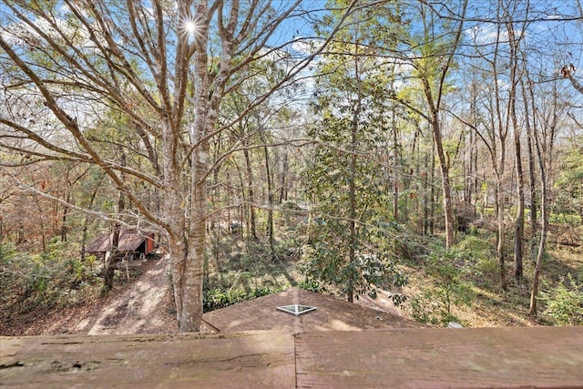 view of yard with a view of trees