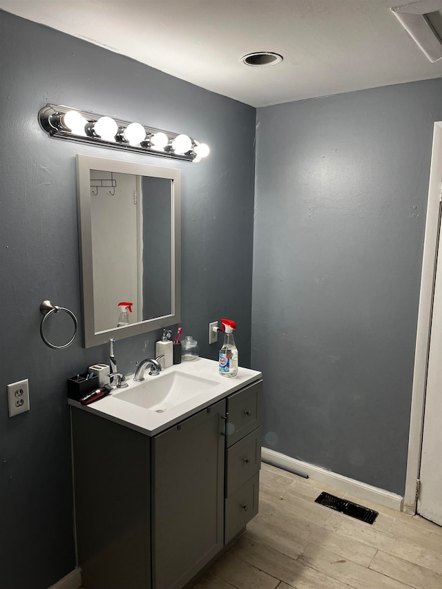 bathroom featuring vanity and hardwood / wood-style flooring