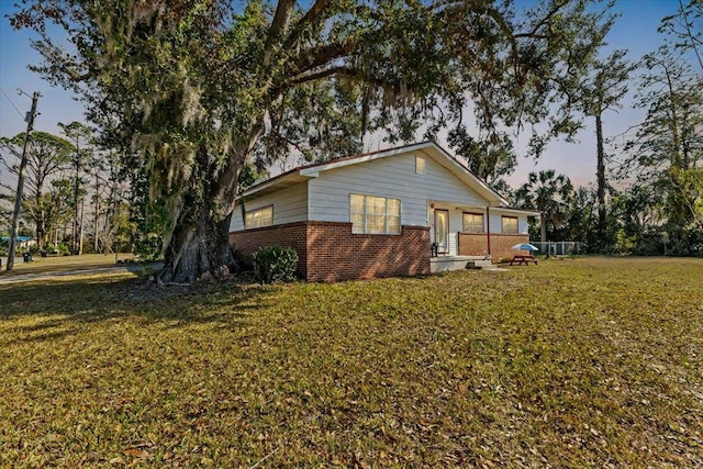 view of front of house with a yard