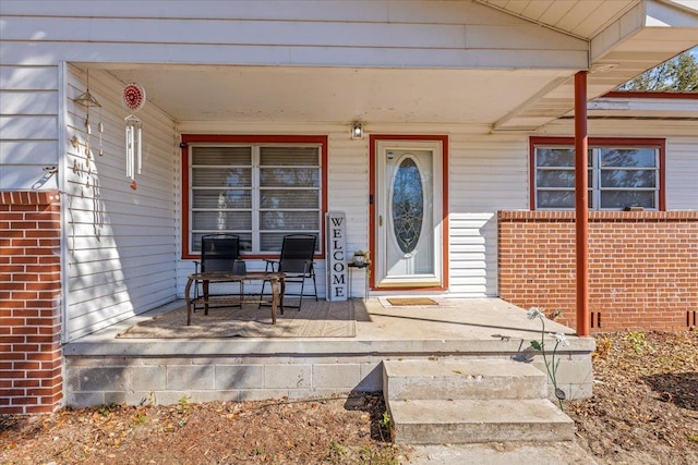 entrance to property featuring a porch