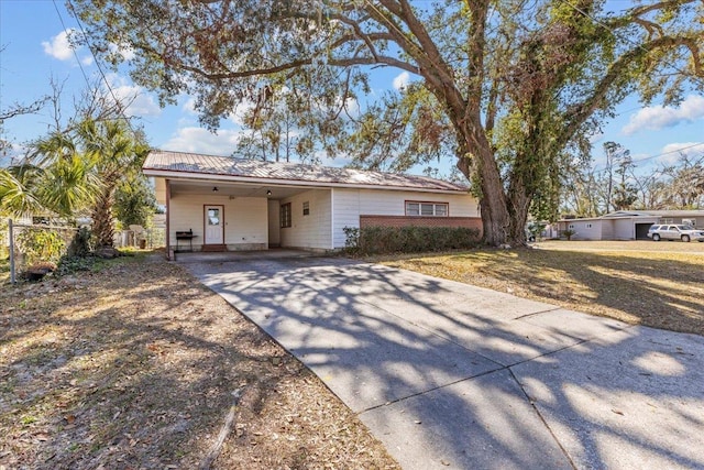 ranch-style house with a carport