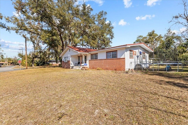 view of front of house featuring a front yard and a porch