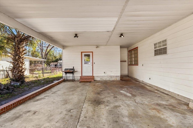 view of patio featuring a carport