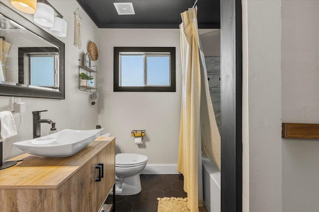 full bathroom featuring shower / tub combo with curtain, vanity, toilet, and tile patterned flooring