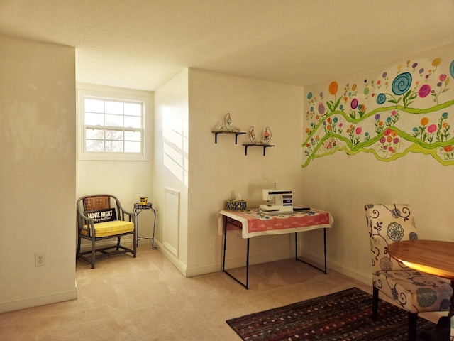 sitting room with carpet floors and baseboards