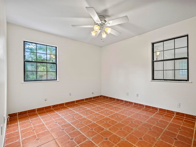 spare room with ceiling fan