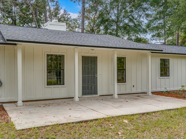 rear view of property featuring a patio