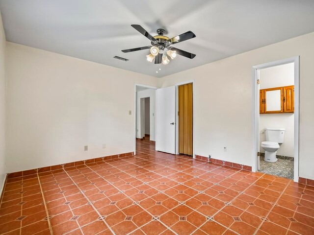 spare room with ceiling fan