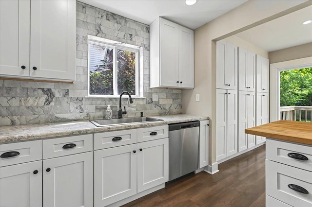 326 N 8th St, Quincy, FL 32351 - kitchen with stainless steel dishwasher, tasteful backsplash, white cabinets, dark wood finished floors, and recessed lighting