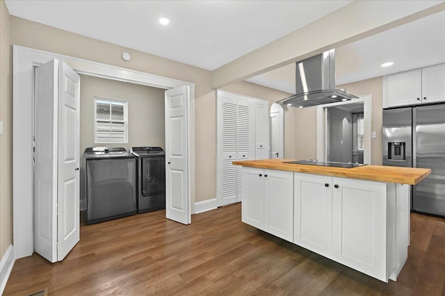 326 N 8th St, Quincy, FL 32351 - kitchen featuring wooden counters, stainless steel fridge with ice dispenser, island range hood, washer and dryer, and black electric stovetop