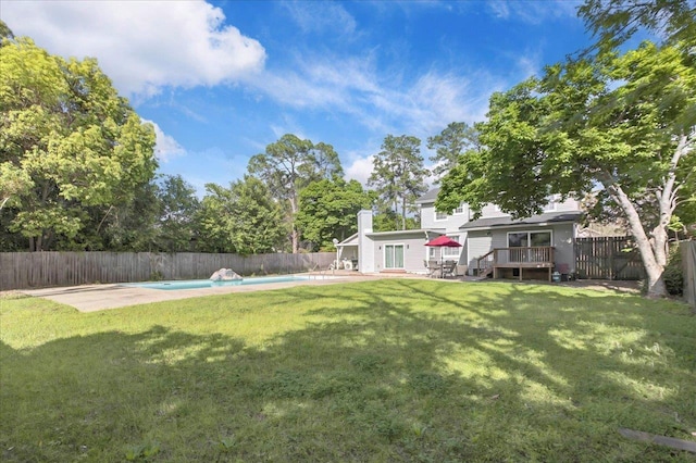 326 N 8th St, Quincy, FL 32351 - fenced backyard with a wooden deck, a patio, and french doors