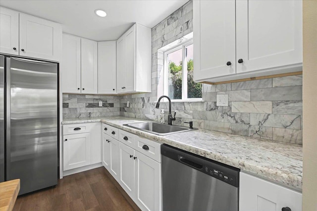326 N 8th St, Quincy, FL 32351 - kitchen with stainless steel appliances, white cabinets, dark wood-style flooring, tasteful backsplash, and recessed lighting