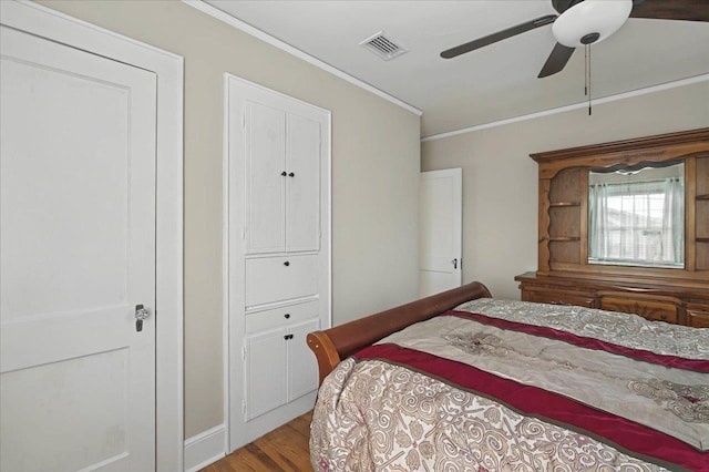 326 N 8th St, Quincy, FL 32351 - bedroom with ornamental molding, wood finished floors, and a ceiling fan