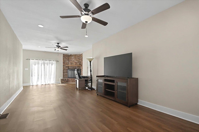 326 N 8th St, Quincy, FL 32351 - unfurnished living room featuring wood finished floors, a fireplace, ceiling fan, and recessed lighting