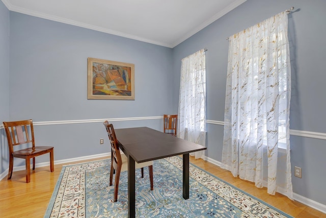 office area featuring light hardwood / wood-style flooring and ornamental molding