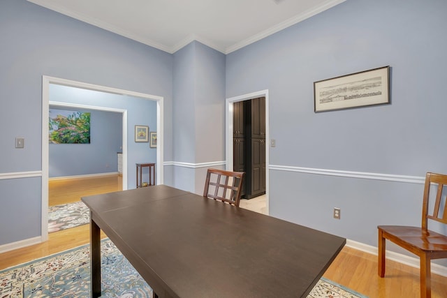 office featuring ornamental molding and light hardwood / wood-style floors