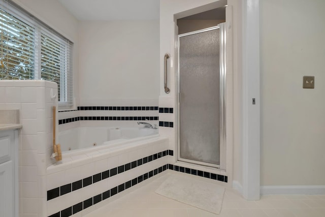 bathroom with tile patterned flooring and separate shower and tub