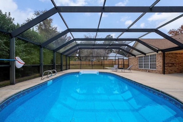 view of pool featuring a lanai and a patio