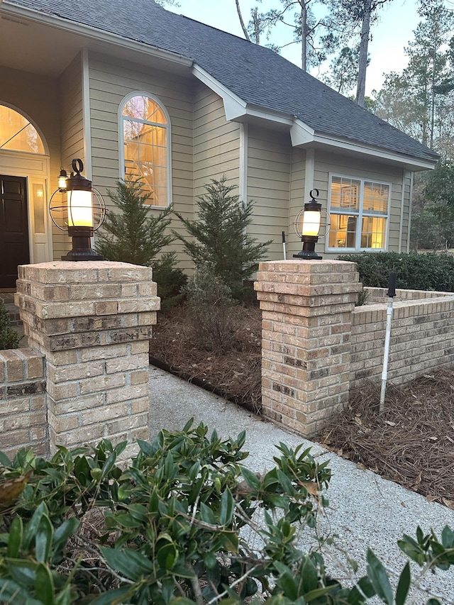 exterior space with a shingled roof