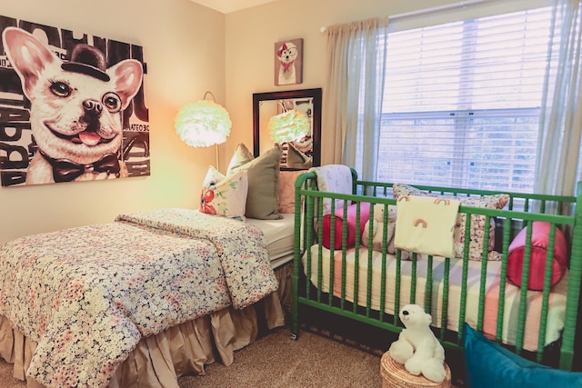 carpeted bedroom featuring multiple windows