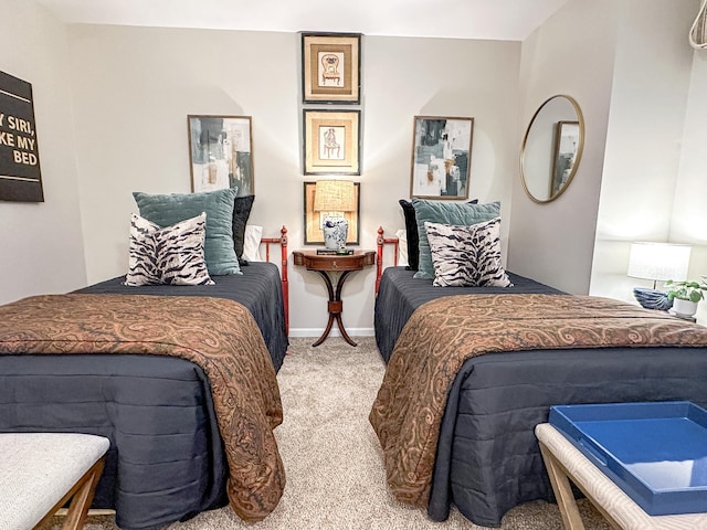 bedroom with baseboards and carpet