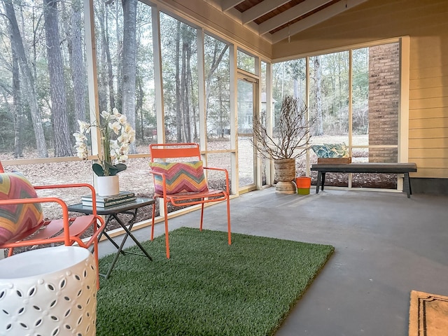 sunroom / solarium with lofted ceiling