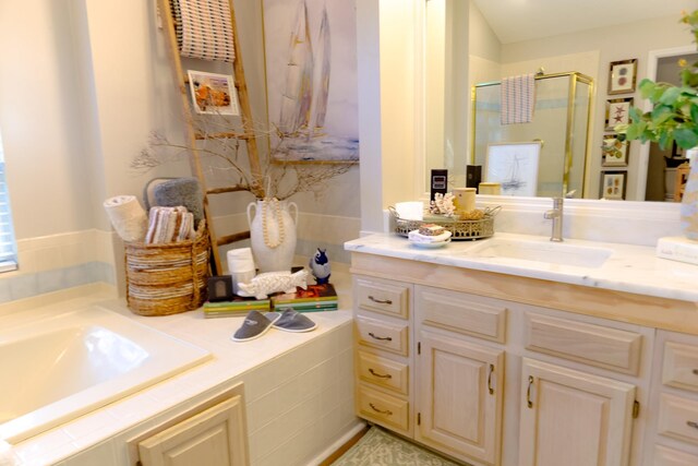 bathroom with a stall shower and vanity