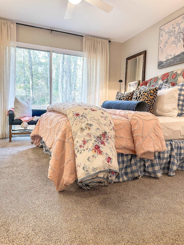 carpeted bedroom with access to exterior and ceiling fan