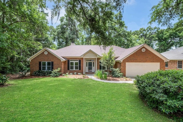 2975 Compton Way, Tallahassee, FL 32309 - single story home with an attached garage, a front lawn, a chimney, and brick siding