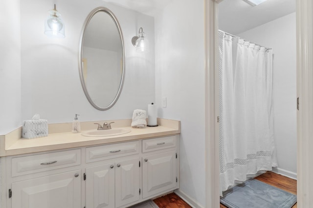 1244 Salem Rd, Havana, FL 32333 - bathroom featuring hardwood / wood-style flooring, vanity, and a shower with shower curtain