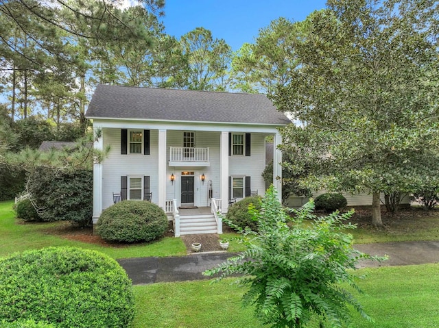 1244 Salem Rd, Havana, FL 32333 - neoclassical home featuring a front yard and a balcony